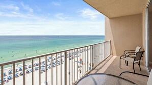 A balcony with a view of a beach and ocean. - Tidewater by Book That Condo (Panama City Beach)