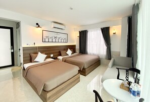 Family Triple Room | Minibar, individually furnished, desk, laptop workspace