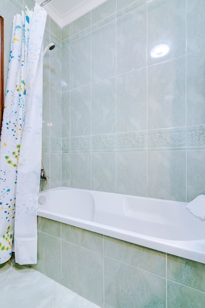 Bathtub, hair dryer, towels