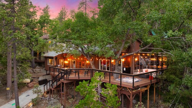 A multi-level wooden cabin with outdoor decks, surrounded by trees and a scenic view. - Unique Modern Cabin w/spa, dry sauna (Idyllwild)