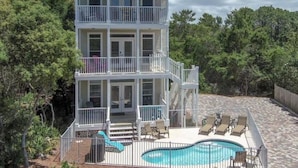 A two-story house with a balcony, a pool, and outdoor furniture. - 30A 5 Minute Walk to Beach / Private Heated Pool / View / Family Vacation (Santa Rosa Beach)