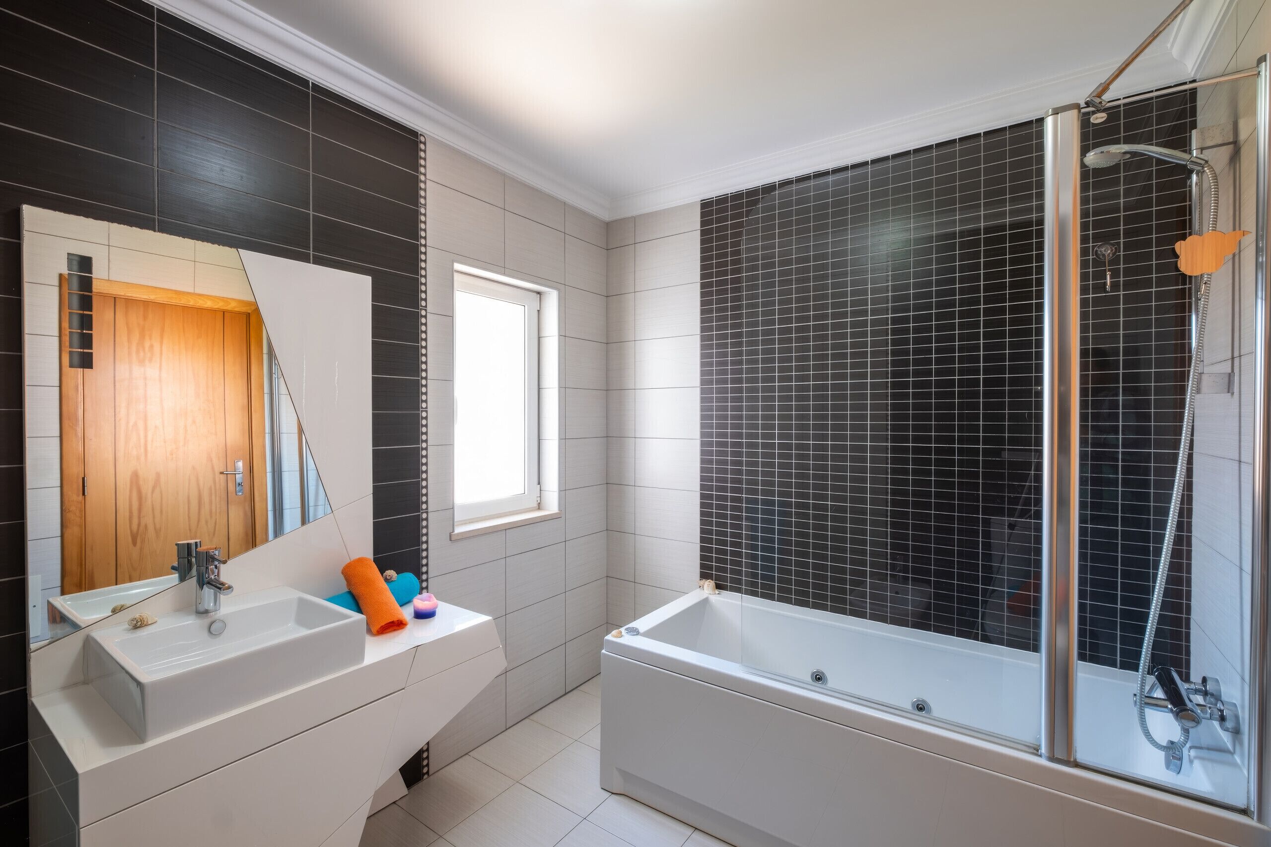 Combined shower/tub, hair dryer, towels, toilet paper