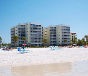 On the beach, sun loungers, beach towels