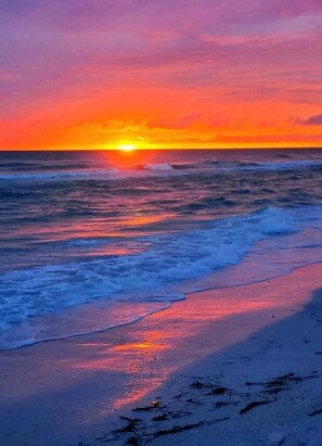 Enjoy a serene beach experience with gentle waves and a peaceful atmosphere.