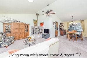 Smart TV, fireplace, books, stereo