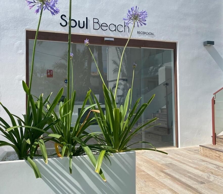 A building with a sign reading "Soul Beach" and a reception area.