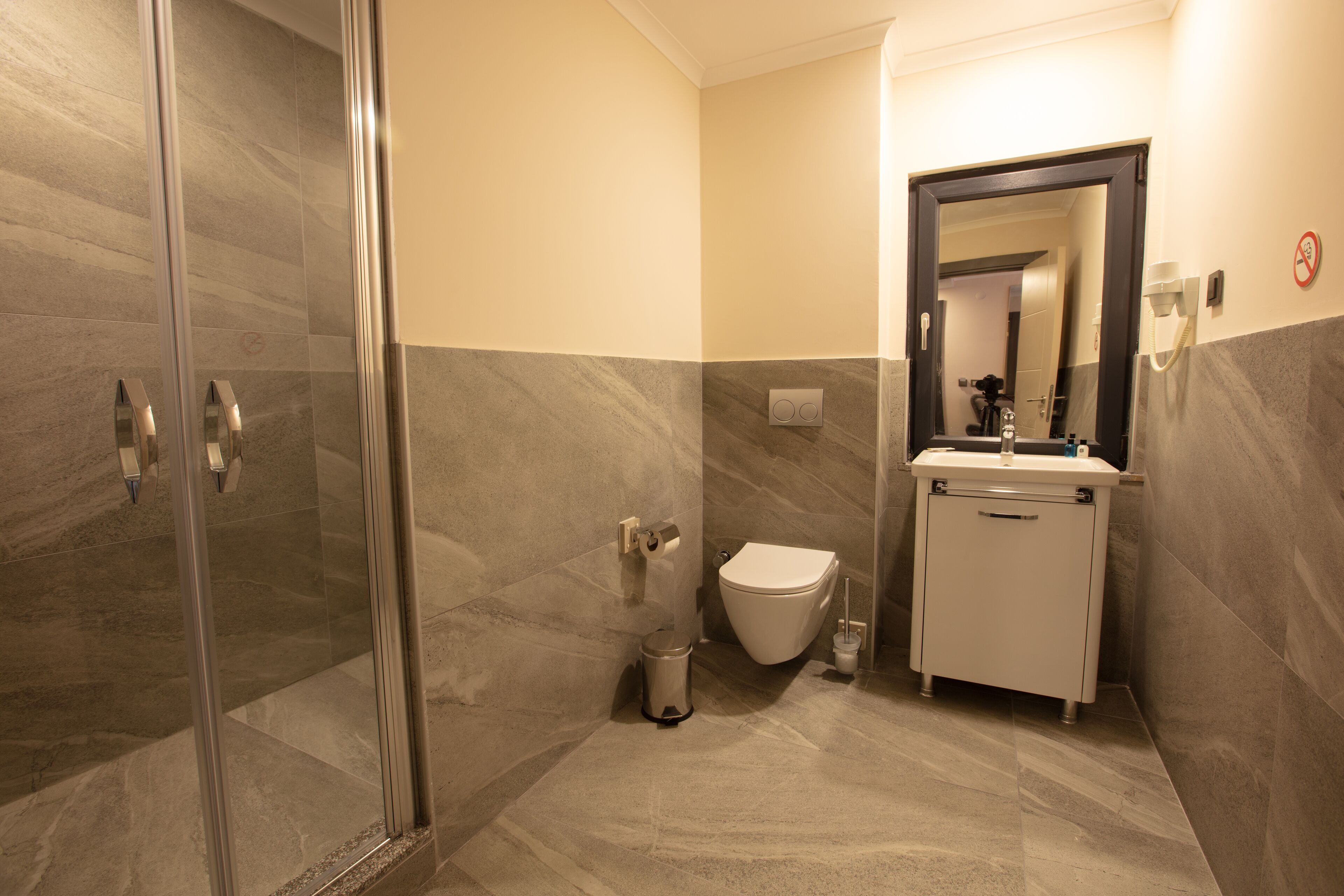 shower, eco-friendly toiletries, hair dryer, slippers