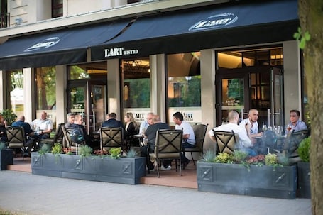Outdoor dining. L'art Hotel Carei