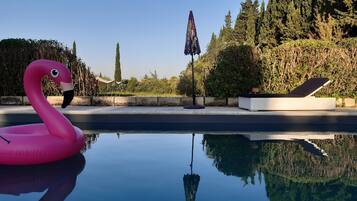 Seasonal outdoor pool, pool umbrellas, sun loungers