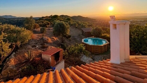 A rooftop terrace with a pool, a small cabin, and a view of the surrounding landscape. - Charming windmill between nature and sea (Palmela)