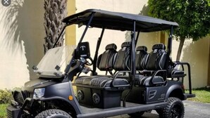 A golf cart with a canopy, four seats, and rugged tires. - Island Townhouse w/ Private Hot Tub! (Corpus Christi)