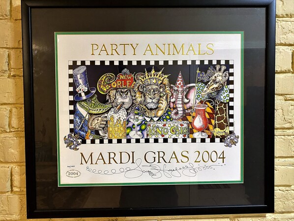 A framed artwork titled 'Party Animals' with a signature and the year '2004'. - Comfortable and Quiet Condo in Perfect LSU/Downtown Area (Baton Rouge)