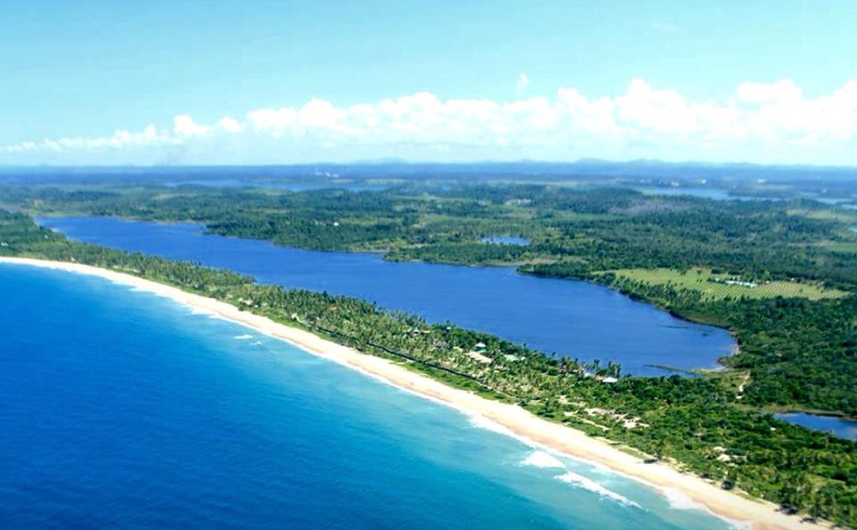 House is on the right side of the pic, on the beach and by the end of the lake.