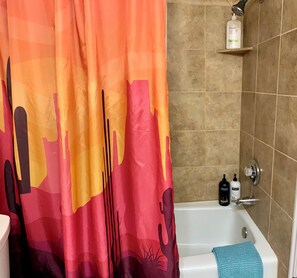 Combined shower/tub, hair dryer, towels, soap