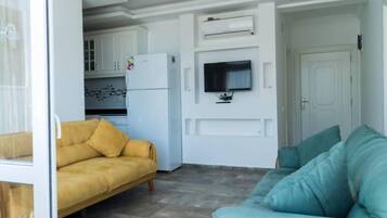 Apartment, 2 Bedrooms (Lavinya) | Living room | Flat-screen TV