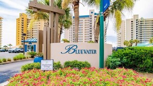 A Bluewater hotel sign with a landscaped garden in front. - High Speed Wi-fi, Corner Unit w/Beach and Pool Views (Orange Beach)