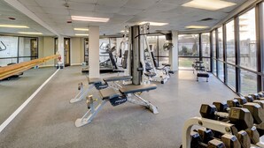 A gym with exercise equipment, large windows, and a mirrored wall. - 🌊Labor Day Available! Aug 30-Sept 3🔥Oceanfront🏝️2 Pools🐬Restaurants Onsite☀️ (North Topsail Beach)