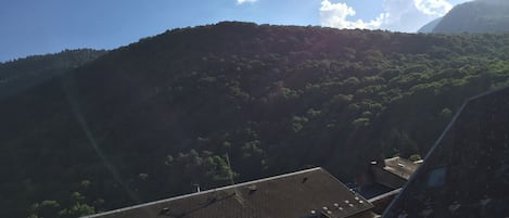 A view of a mountain with a clear sky.