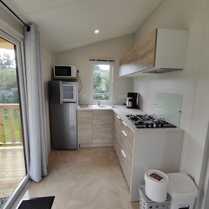 Fridge, microwave, stovetop, coffee/tea maker