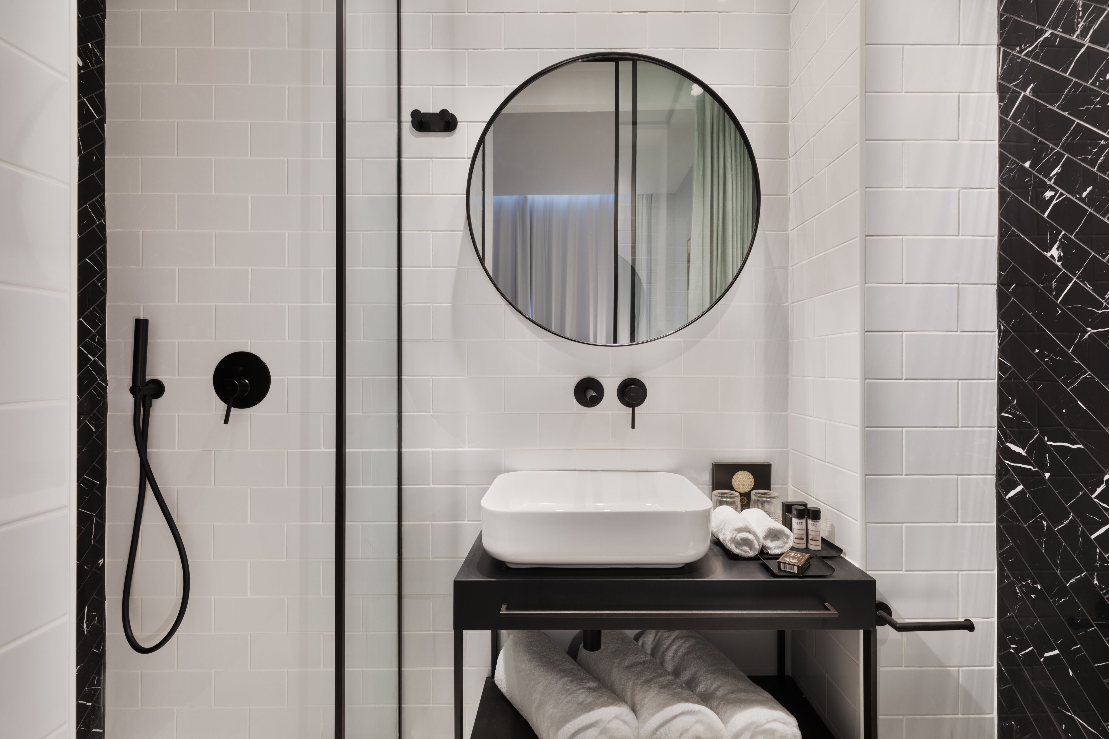 shower, hair dryer, towels, toilet paper