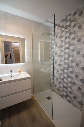 Bathtub, hair dryer, towels, soap