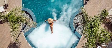 Seasonal outdoor pool, open 9:00 AM to 7:00 PM, pool umbrellas