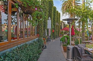 Enjoy a casual dining experience in our outdoor seating area, surrounded by lush greenery and natural beauty.