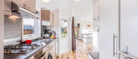 Fridge, stovetop, dishwasher, coffee/tea maker