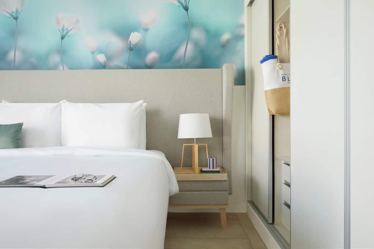 Suite, Non Smoking, Pool View (1 King Bed, 2 Single Beds) | Premium bedding, memory foam beds, in-room safe, iron/ironing board