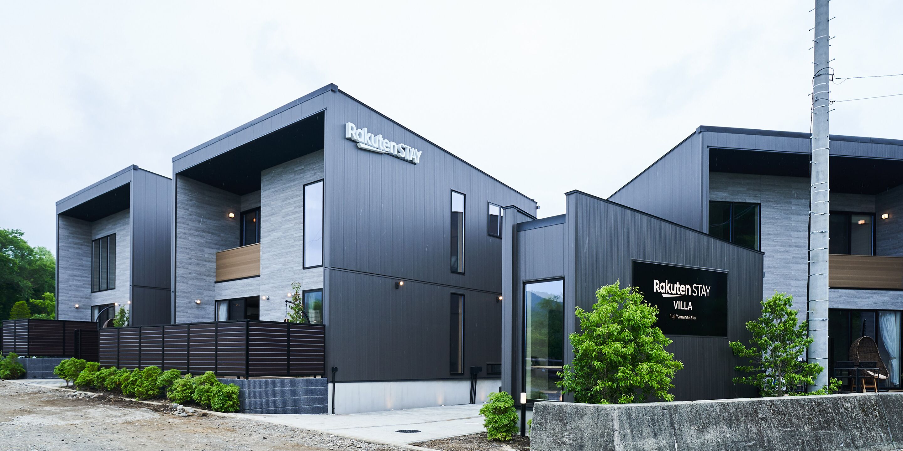 A modern building with a sign reading "Rakuten Stay Villa."