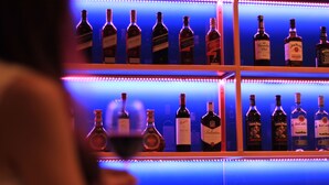 A bar with shelves of liquor bottles.