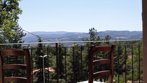 Two wooden chairs with cushions on a balcony overlooking a mountainous landscape. - Wonderful Villa With Private Pool in the Heart of Tuscany (Pratovecchio Stia)
