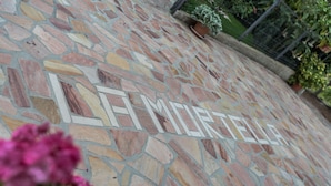 A stone pavement with the word "LA MORTELLA" engraved. - Bb La Mortella With Pool (Roccadaspide)