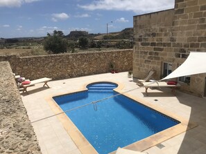 Outdoor pool, open 7:30 AM to 7:30 PM, pool umbrellas, pool loungers