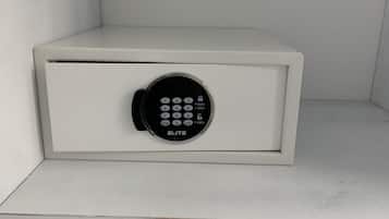 A white safe with a keypad lock labeled "ELITE".