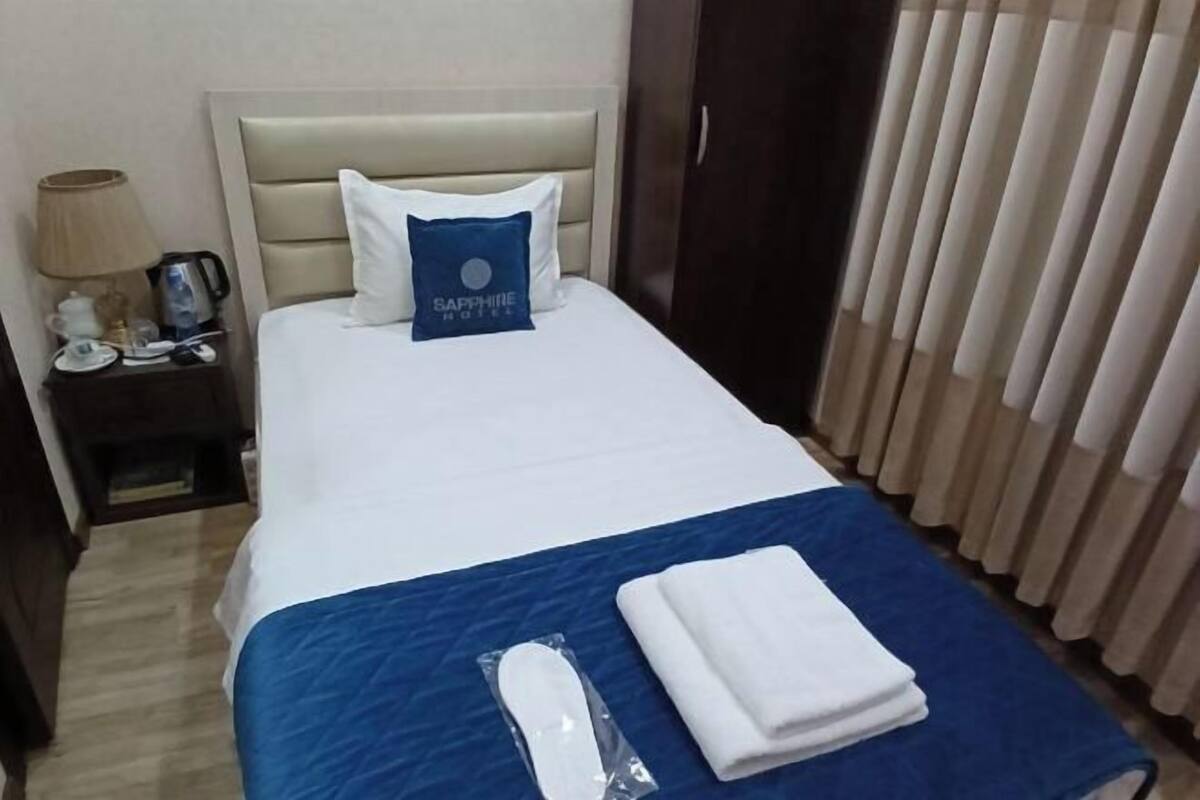 Premium bedding, desk, laptop workspace, blackout drapes