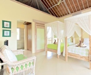 A room with a bed under a canopy, a wicker chair with a cushion, and a door leading to another room. - Villa Semua Suka, the Ricefields of Ubud, 2bd2baacpoolbest Bkfast in Bali (Ubud)