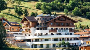 A multi-story hotel with a sign reading "DAS LANDERER" on the upper floor. - Das Landerer (Ladis)