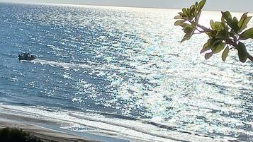 On the beach, sun-loungers, beach towels