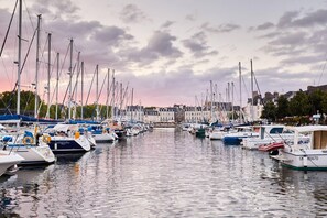 Enjoy a serene waterfront experience with stunning views of the marina and its diverse boats.