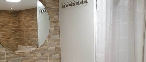 Bathtub, jetted tub, hair dryer, toilet paper