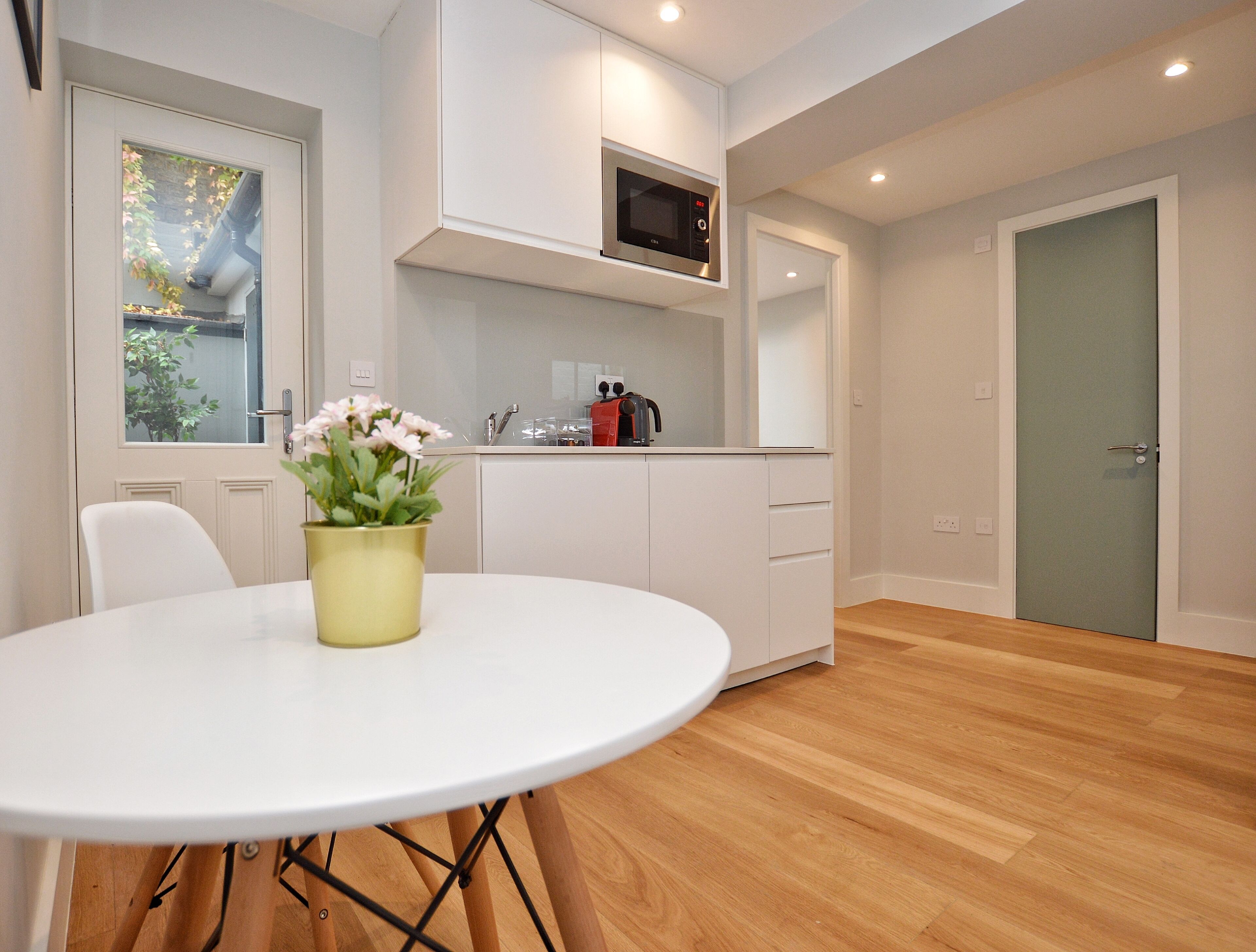 Small Lower Ground Floor Studio | Living area | Flat-screen TV, heated floors