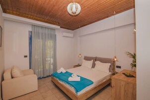 Comfort Triple Room | Premium bedding, memory foam beds, in-room safe, laptop workspace