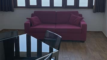 Family Apartment | Living area | 30-inch TV with digital channels