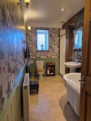 Bathtub, hair dryer, towels, soap