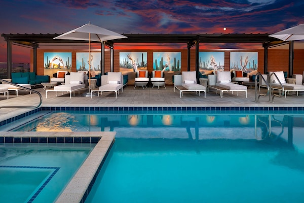 Outdoor pool, open 8:00 AM to 10:00 PM, cabanas (surcharge)