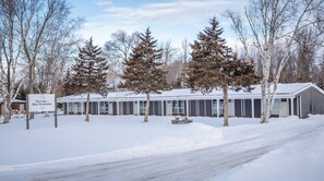 Enjoy the serene views from large windows and relax in the covered outdoor area.