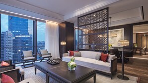A modern hotel lobby with a large sofa, armchairs, a coffee table, and a decorative partition. - ANDAZ XIAMEN, BY HYATT (Xiamen)