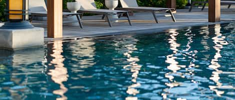 Outdoor pool, open 6:00 AM to 10:00 PM, sun loungers