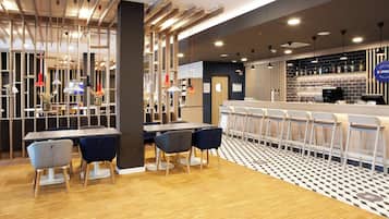 A modern bar area with a counter, seating, and a patterned floor.